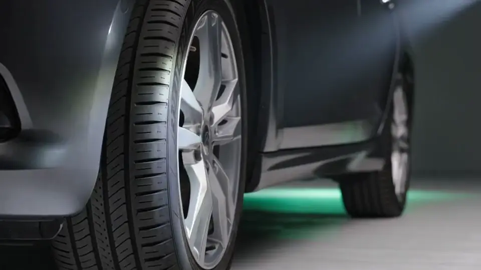 Illustration of a close-up tire, brake and body inspection